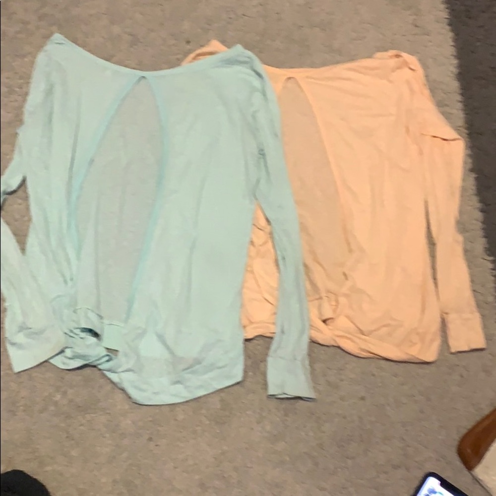 Two blue and pink shirts with opener backs.